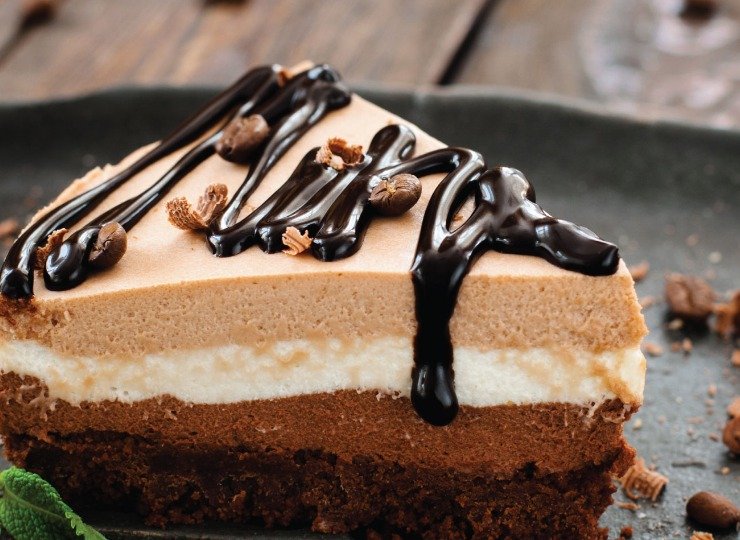 Delicious Cheesecake from The Belly Desserts, Romford's Best Desserts Chocolate cheesecake drizzled with chocolate sauce and garnished with mint